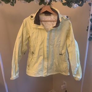 REI light yellow rain jacket